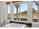 Close up view of a marble-clad tub with outdoor views and a white trim at 2001 Alcova Ridge Dr, Las Vegas, NV 89135