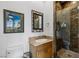 Well-lit bathroom featuring a marble shower, vanity, and modern fixtures at 2001 Alcova Ridge Dr, Las Vegas, NV 89135