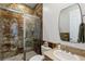 Bathroom with marbled shower, neutral stone vanity, and modern finishes at 2001 Alcova Ridge Dr, Las Vegas, NV 89135