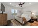 Cozy bedroom featuring a ceiling fan, wooden accents, and an area rug at 2001 Alcova Ridge Dr, Las Vegas, NV 89135