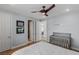 Bright bedroom features hardwood floors, ceiling fan, and a ceiling light at 2001 Alcova Ridge Dr, Las Vegas, NV 89135