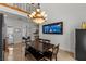 Bright dining area featuring a wooden table, a chandelier, and access to the backyard at 2001 Alcova Ridge Dr, Las Vegas, NV 89135