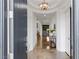 Grand foyer with marble flooring, a decorative light fixture, and an open view of the home at 2001 Alcova Ridge Dr, Las Vegas, NV 89135