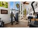 Bright home gym with exercise equipment, bar area, and lots of natural light at 2001 Alcova Ridge Dr, Las Vegas, NV 89135