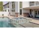 Beautiful pool with a spillover hot tub and covered patio in the background at 2001 Alcova Ridge Dr, Las Vegas, NV 89135