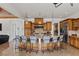 Spacious kitchen with a large central island, stainless steel appliances and bar stool seating at 2001 Alcova Ridge Dr, Las Vegas, NV 89135