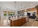 Open kitchen design with a large island bar, stainless appliances and easy living room access at 2001 Alcova Ridge Dr, Las Vegas, NV 89135