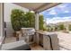 Outdoor kitchen with stainless steel grill, granite countertop, and spacious patio area at 2001 Alcova Ridge Dr, Las Vegas, NV 89135