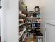 Walk-in pantry with stocked shelving and food storage containers at 2001 Alcova Ridge Dr, Las Vegas, NV 89135