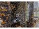 Marble shower with glass door, built in seat, and shower supplies at 2001 Alcova Ridge Dr, Las Vegas, NV 89135