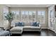 Inviting sitting area with large windows and plush sectional sofa, perfect for relaxation and enjoying natural light at 2001 Alcova Ridge Dr, Las Vegas, NV 89135