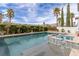 Sparkling swimming pool with spa and lush landscaping, perfect for relaxation at 2001 Alcova Ridge Dr, Las Vegas, NV 89135