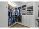 Organized walk-in closet with custom shelving, drawers, and ample hanging space for clothes and accessories at 2001 Alcova Ridge Dr, Las Vegas, NV 89135