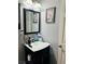 Cozy bathroom features a unique flamingo art piece, adding a touch of personality to the space at 228 E Van Wagenen St, Henderson, NV 89015