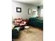 Cozy bedroom with comfy chairs, decorative accents, and a bright window at 228 E Van Wagenen St, Henderson, NV 89015
