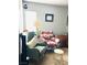 Cozy bedroom with comfy chairs, decorative accents, and a bright window at 228 E Van Wagenen St, Henderson, NV 89015