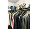 Well-organized closet with hanging clothes, shelves, and accessories at 228 E Van Wagenen St, Henderson, NV 89015