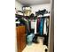 Organized closet with hanging clothes, shelves, and storage for clothes, shoes, and accessories at 228 E Van Wagenen St, Henderson, NV 89015