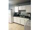 Functional kitchen featuring white cabinets, and stainless steel sink at 228 E Van Wagenen St, Henderson, NV 89015