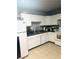 Functional kitchen featuring white cabinets, and stainless steel sink at 228 E Van Wagenen St, Henderson, NV 89015
