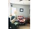Inviting living room featuring cozy armchairs, a side table, and natural light from the nearby window at 228 E Van Wagenen St, Henderson, NV 89015