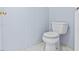 Toilet with white walls and white marble tile flooring in half bath at 2419 Country Orchard St, North Las Vegas, NV 89030