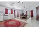 Open-concept kitchen with dining area, white cabinets, and stainless steel appliances at 2419 Country Orchard St, North Las Vegas, NV 89030