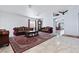 Elegant living room with marble floors, stylish sofas, and a beautiful area rug at 2419 Country Orchard St, North Las Vegas, NV 89030