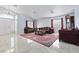 Bright living room with marble floors, classic furniture, and ample natural light at 2419 Country Orchard St, North Las Vegas, NV 89030