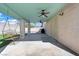 Covered patio with concrete flooring, ceiling fans, and a hanging swing at 2419 Country Orchard St, North Las Vegas, NV 89030