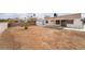 View of the property's spacious backyard featuring a covered patio and shed, providing room for outdoor living at 3309 Marionette Ave, Las Vegas, NV 89101