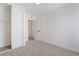Neutral carpeted bedroom with white walls and trim, with a closet with sliding doors at 3309 Marionette Ave, Las Vegas, NV 89101
