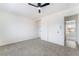 Sunlit bedroom with a ceiling fan, closet and view to another room at 3309 Marionette Ave, Las Vegas, NV 89101