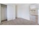 Bright bedroom with neutral carpet, walk-in closet and an open doorway at 3309 Marionette Ave, Las Vegas, NV 89101