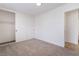 Bright bedroom featuring neutral carpet, white trim and a closet with sliding doors at 3309 Marionette Ave, Las Vegas, NV 89101