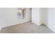 Cozy bedroom with plush carpeting and natural light from the large window at 3309 Marionette Ave, Las Vegas, NV 89101