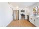 Modern kitchen featuring stainless steel appliances and sleek white cabinetry at 3309 Marionette Ave, Las Vegas, NV 89101