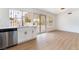 Bright kitchen featuring white cabinetry, stainless steel appliances, and a kitchen sink at 3309 Marionette Ave, Las Vegas, NV 89101