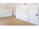 Open-concept living area with a stylish lighting fixture and modern white door at 3309 Marionette Ave, Las Vegas, NV 89101
