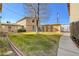 Nice backyard with a small patch of grass, a storage unit and apartments at 3821 1/2 Daisy St # 25, Las Vegas, NV 89119