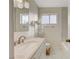 Updated bathroom featuring a modern vanity and chrome fixtures with tiled shower at 3821 1/2 Daisy St # 25, Las Vegas, NV 89119