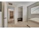 Bedroom featuring sliding closet doors, carpeted floor, and large window at 3821 1/2 Daisy St # 25, Las Vegas, NV 89119