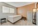 Clean, well-lit bedroom with wood paneling and a comfortable queen bed at 3821 1/2 Daisy St # 25, Las Vegas, NV 89119