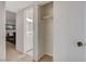 Hallway with linen closet leading to white bathroom with hexagon tile floor at 3821 1/2 Daisy St # 25, Las Vegas, NV 89119