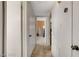 Hallway with neutral carpet leading to other rooms in the home at 3821 1/2 Daisy St # 25, Las Vegas, NV 89119