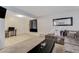 Comfortable living room view showcases the layout and connection to the kitchen area at 3821 1/2 Daisy St # 25, Las Vegas, NV 89119