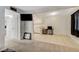 Spacious open floor plan with modern decor, connecting the living room and kitchen at 3821 1/2 Daisy St # 25, Las Vegas, NV 89119