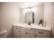 Bathroom vanity featuring a modern faucet and decorative mirror at 3823 S Maryland Pkwy # L6, Las Vegas, NV 89119