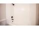 White tiled bathtub with shower and matte black hardware fixtures at 3823 S Maryland Pkwy # L6, Las Vegas, NV 89119