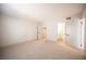 Bright bedroom with plush carpet, and views of both the bathroom and walk-in closet at 3823 S Maryland Pkwy # L6, Las Vegas, NV 89119
